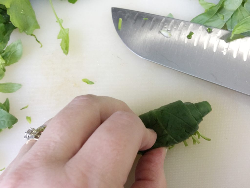 roll basil to make chiffonade